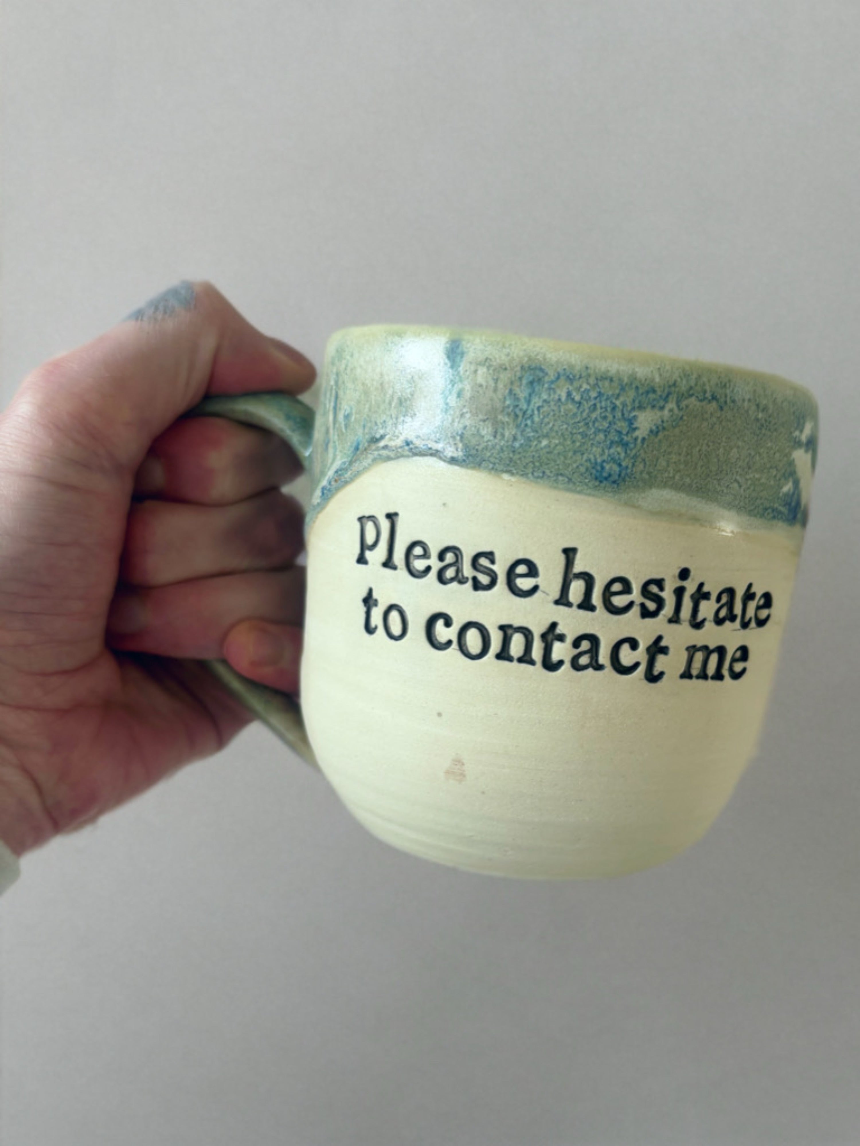 Please hesitate to contact me mug