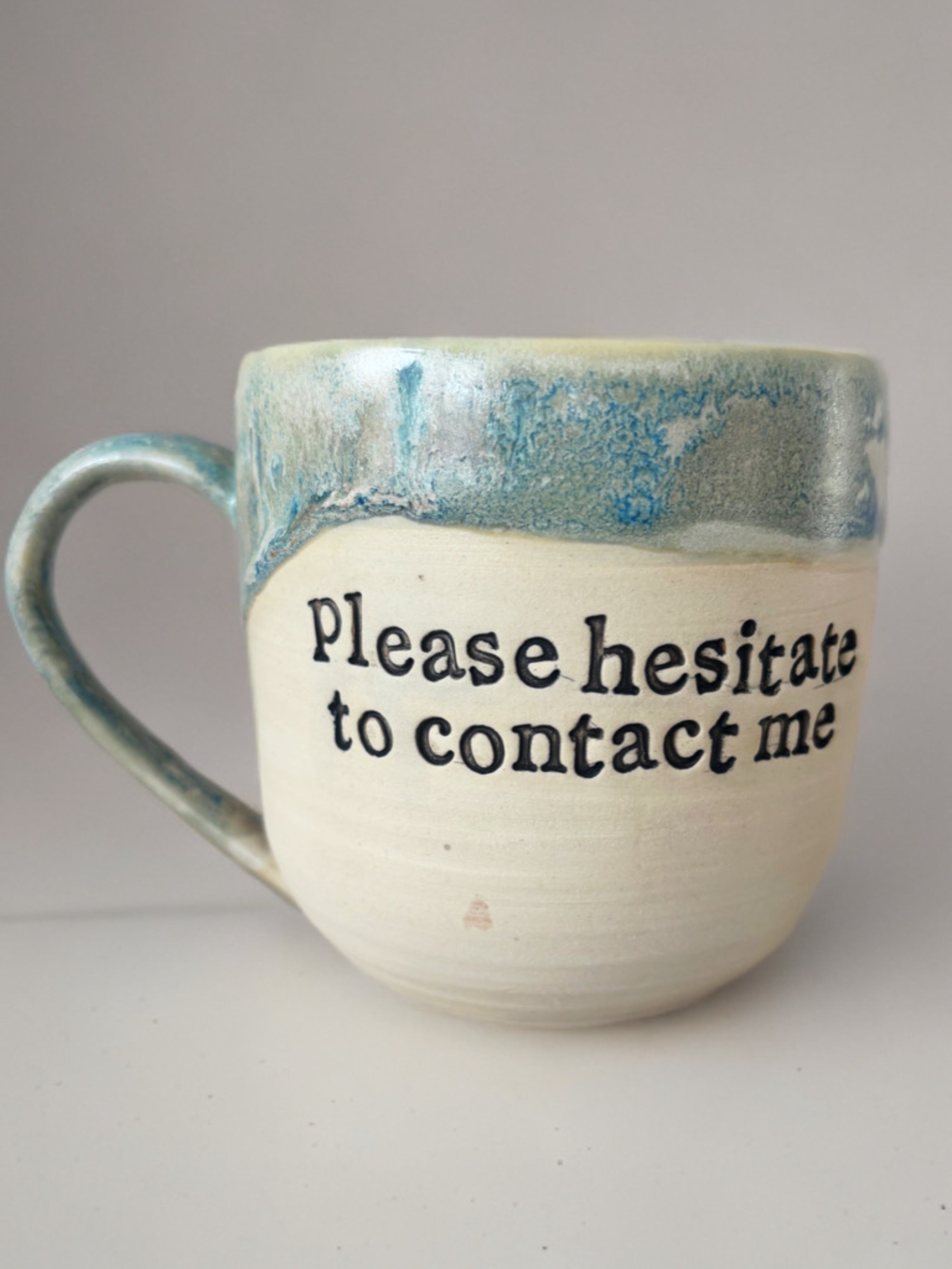 Please hesitate to contact me mug