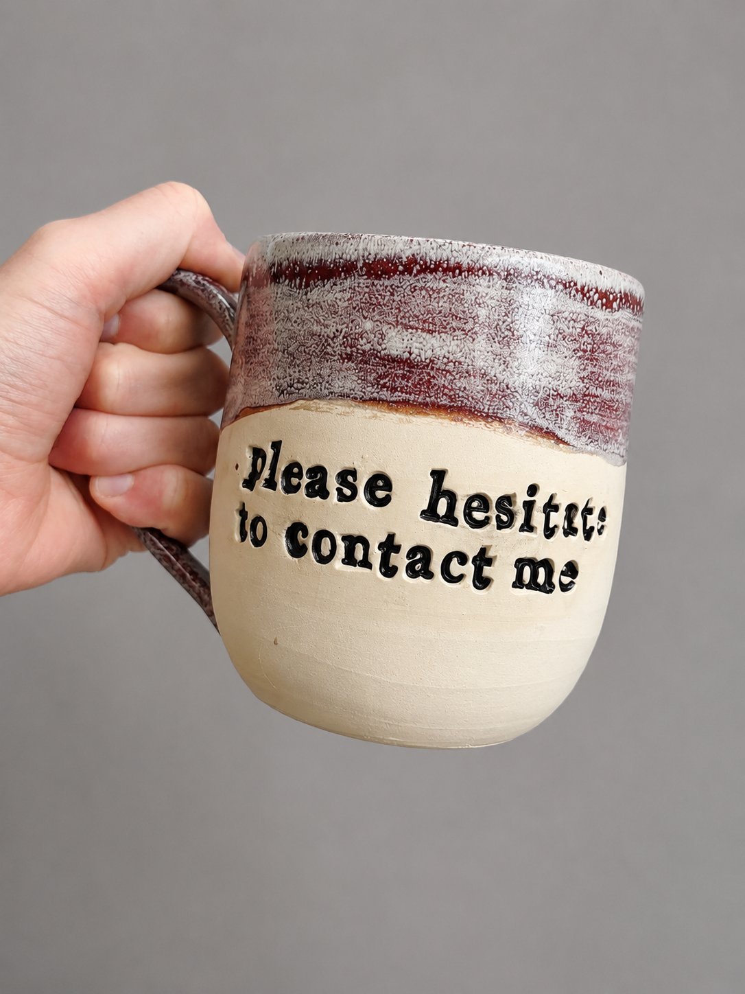 Please hesitate to contact me mug