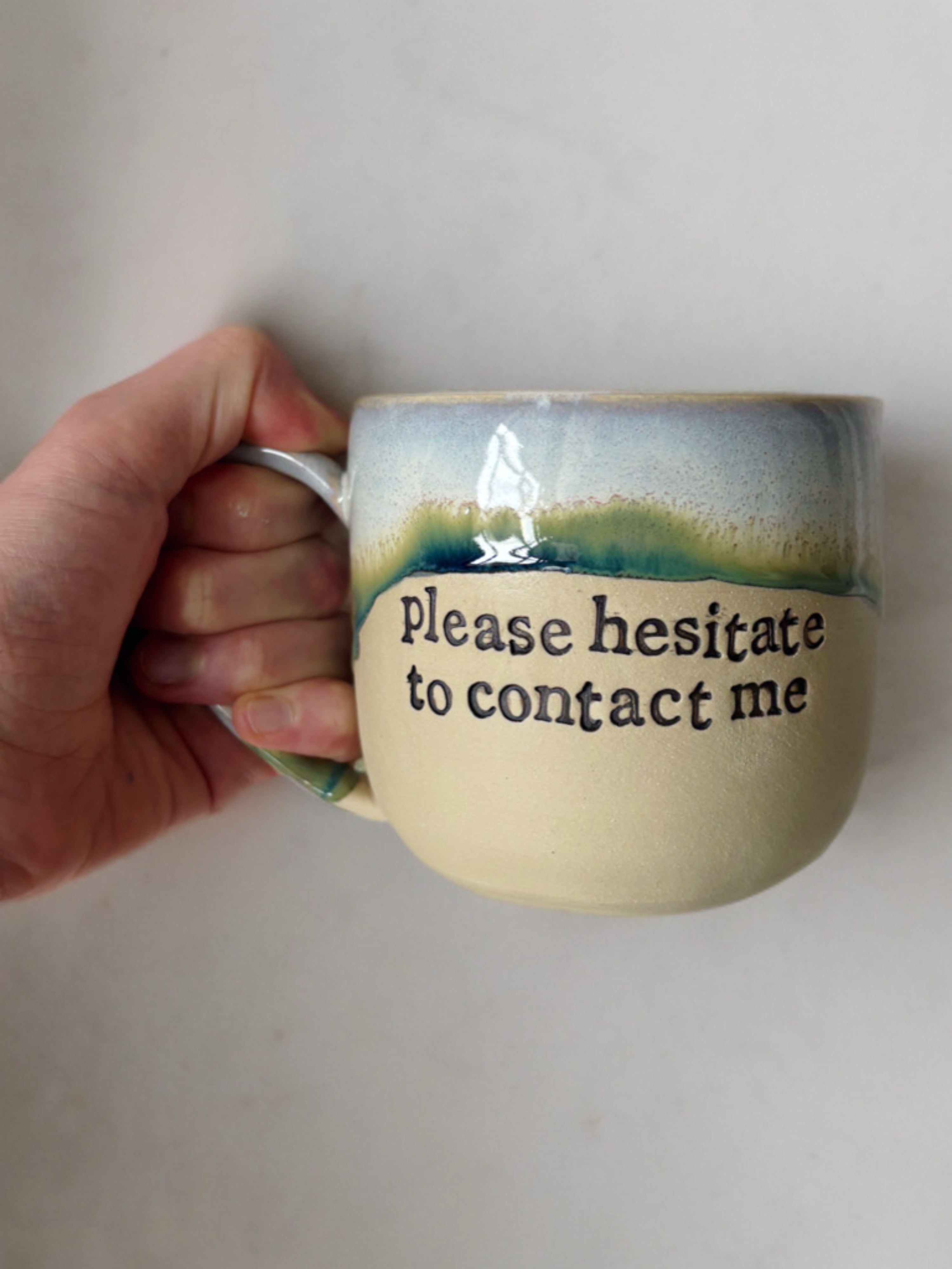 Please hesitate to contact me mug